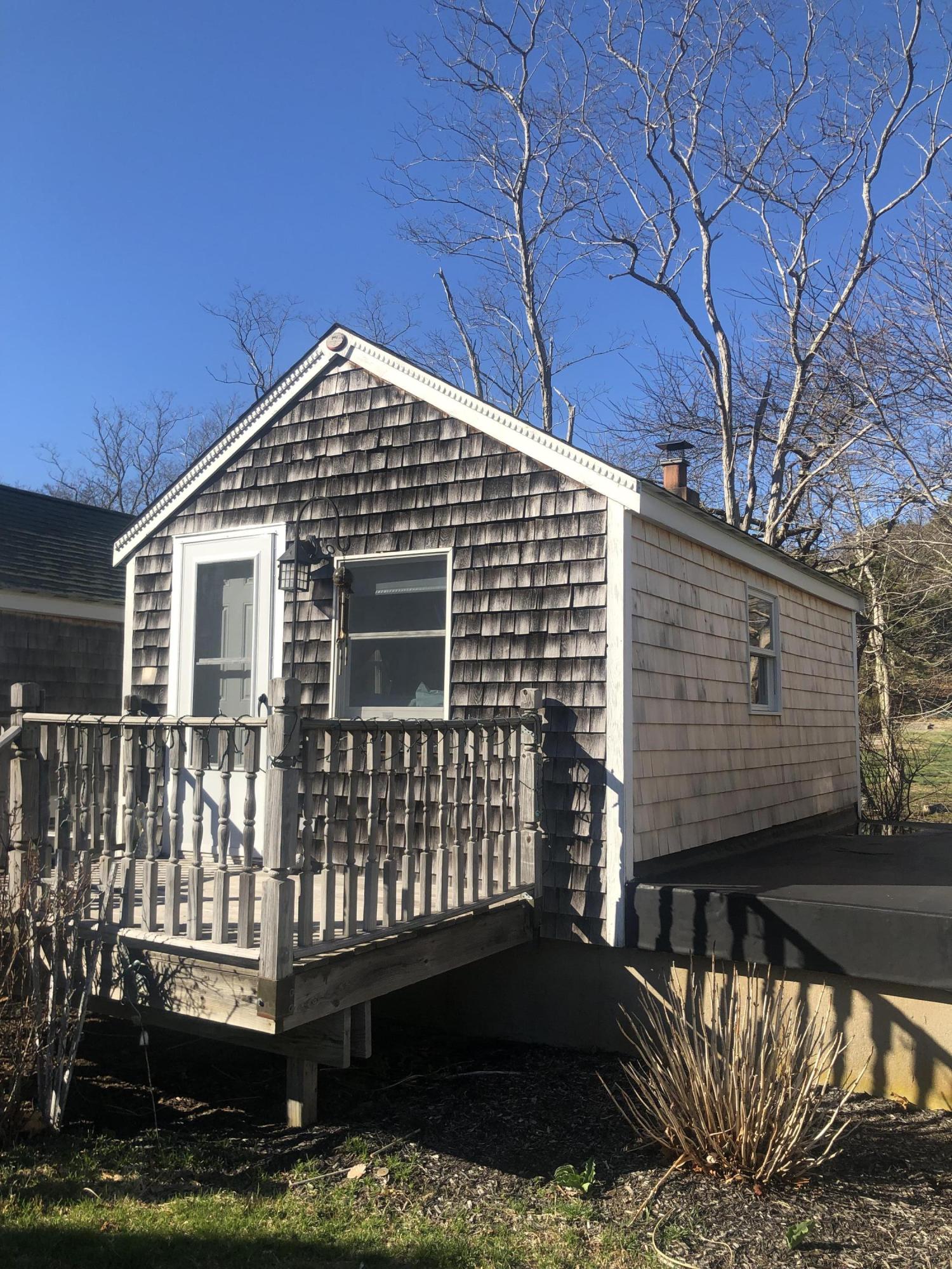 17 Shore Road, Unit 7 Truro, MA 02666 - Photo 5 of 11 a front view of a house with a yard