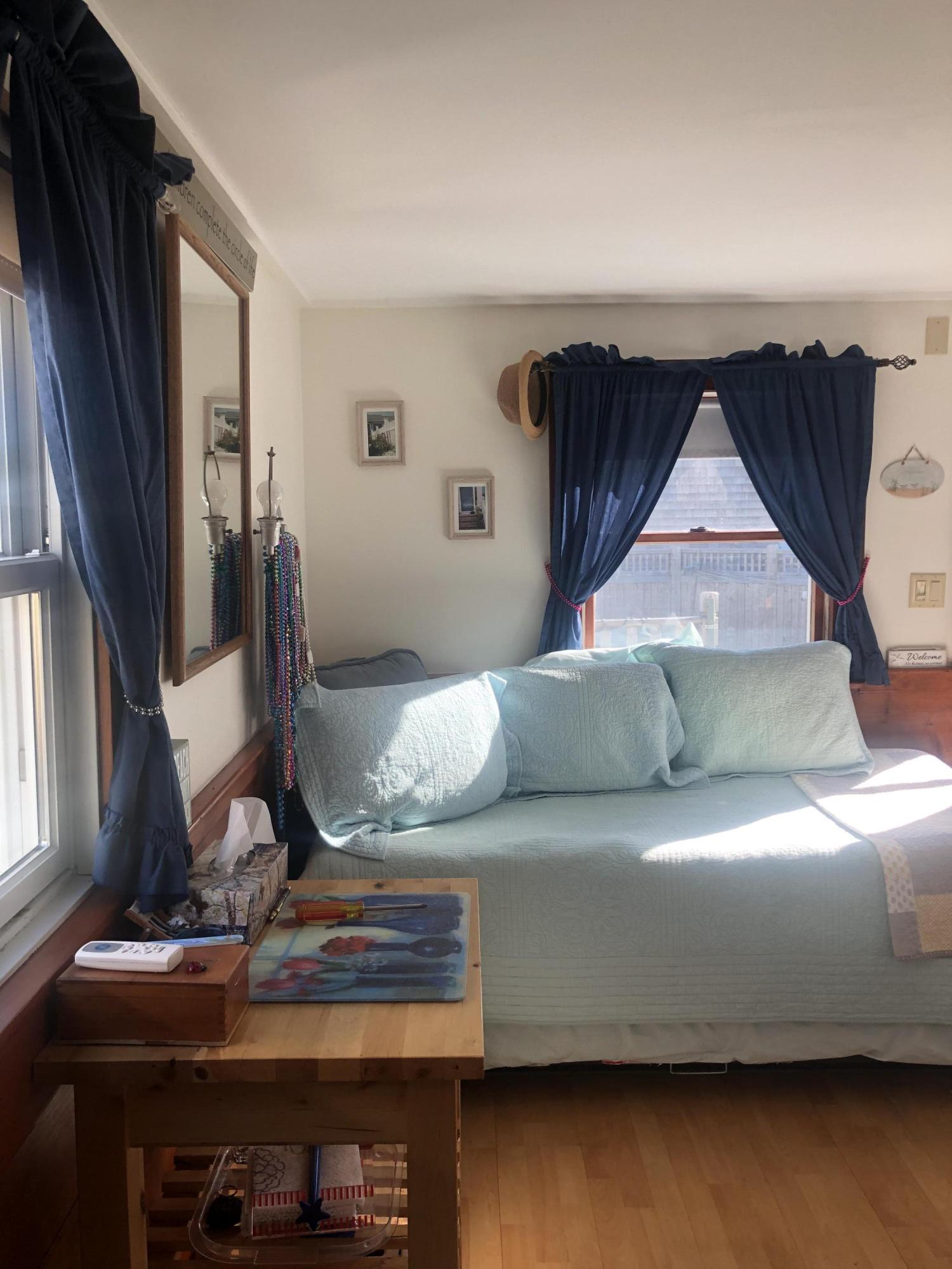 17 Shore Road, Unit 7 Truro, MA 02666 - Photo 10 of 11 a bedroom with a bed and window