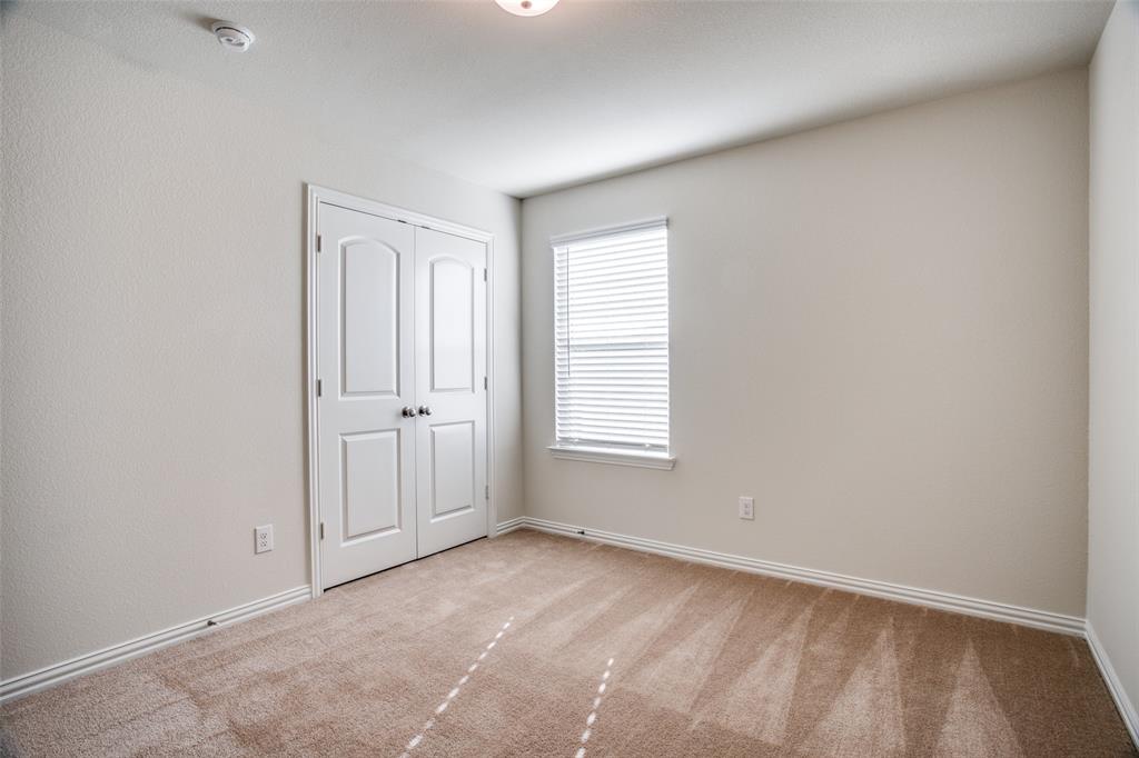 1237 Sharp Street Anna, TX 75409 - Photo 11 of 18 an empty room with windows