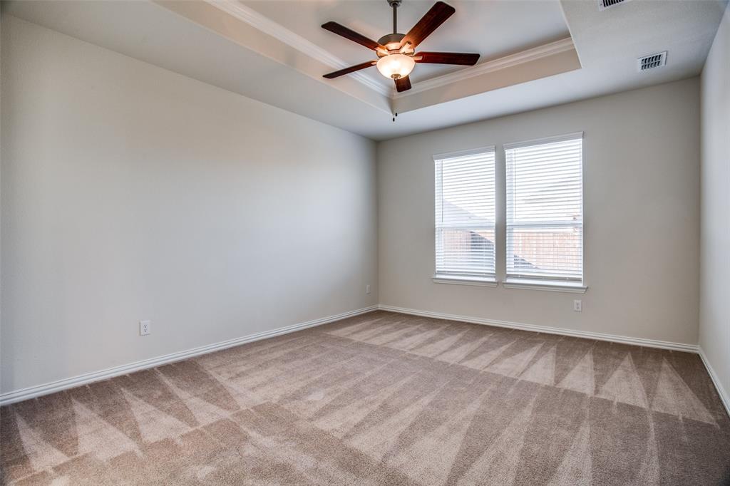 1237 Sharp Street Anna, TX 75409 - Photo 7 of 18 an empty room with windows and fan