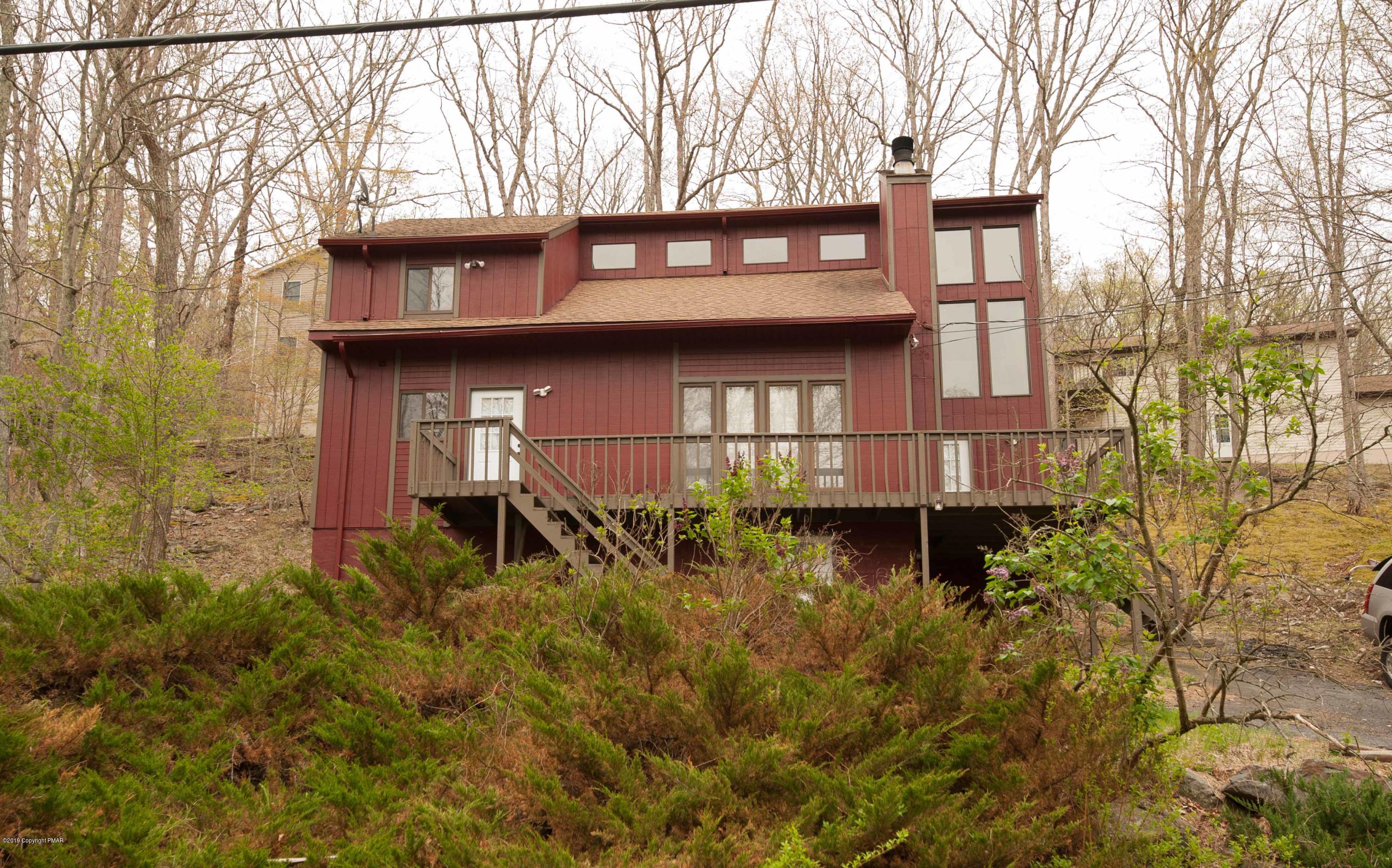 6277 Decker Road Bushkill, PA 18324 - Photo 33 of 34 a view of a house with a small yard and large tree
