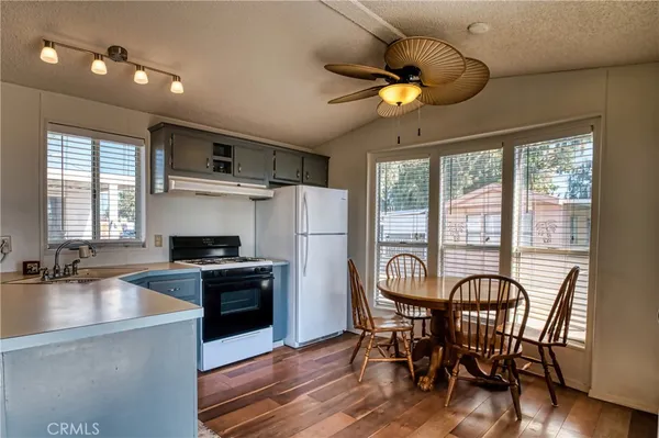 a living room with furniture a couch and a chandelier