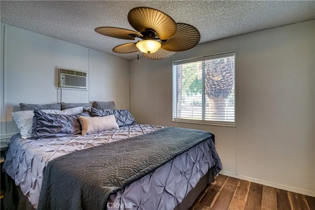a view of a swimming pool with a patio and a yard