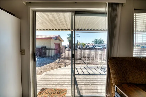 a view of a backyard with a garden and palm trees