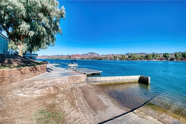 an aerial view of a houses with a lake view