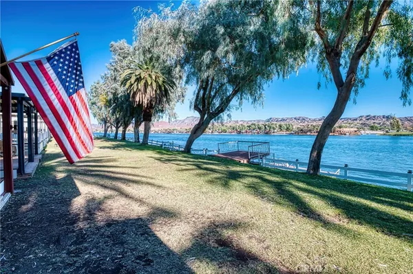 a view of a town with mountains in the background