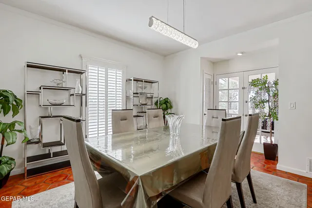 a kitchen with stainless steel appliances granite countertop a stove top oven a sink dishwasher and cabinets with wooden floor