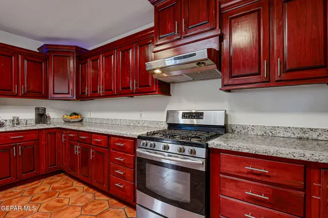 a kitchen with sink and center island