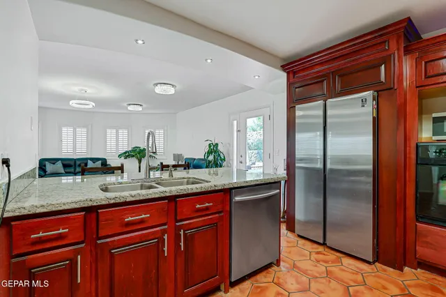 a roof deck with a table and chairs
