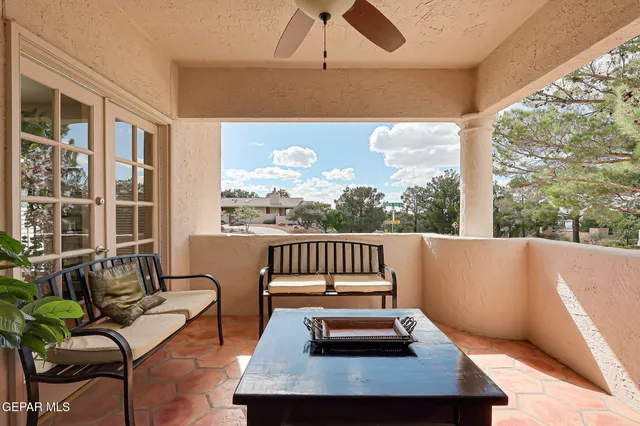 a view of balcony with furniture