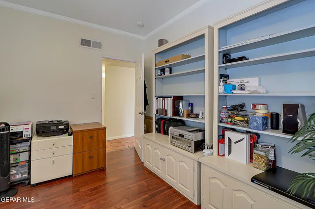 a stove top oven sitting inside of a kitchen