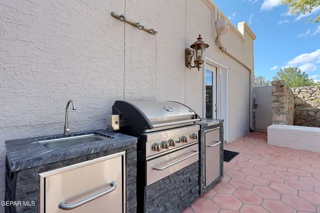 a view of a roof deck with wooden fence and floor