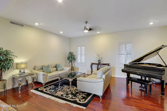 a living room with furniture and a rug