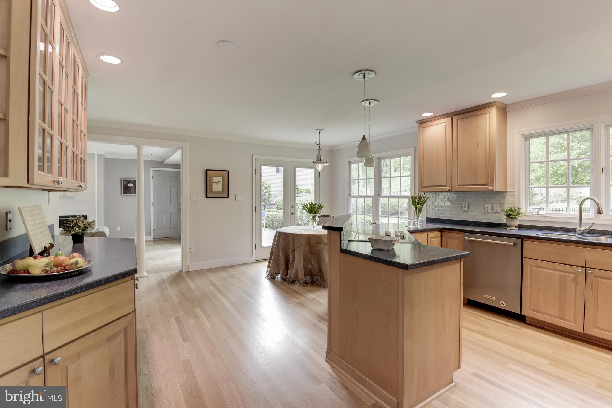 10394 Adel Road Oakton, VA 22124 - Photo 11 of 21 Light filled kitchen shows french doors to patio
