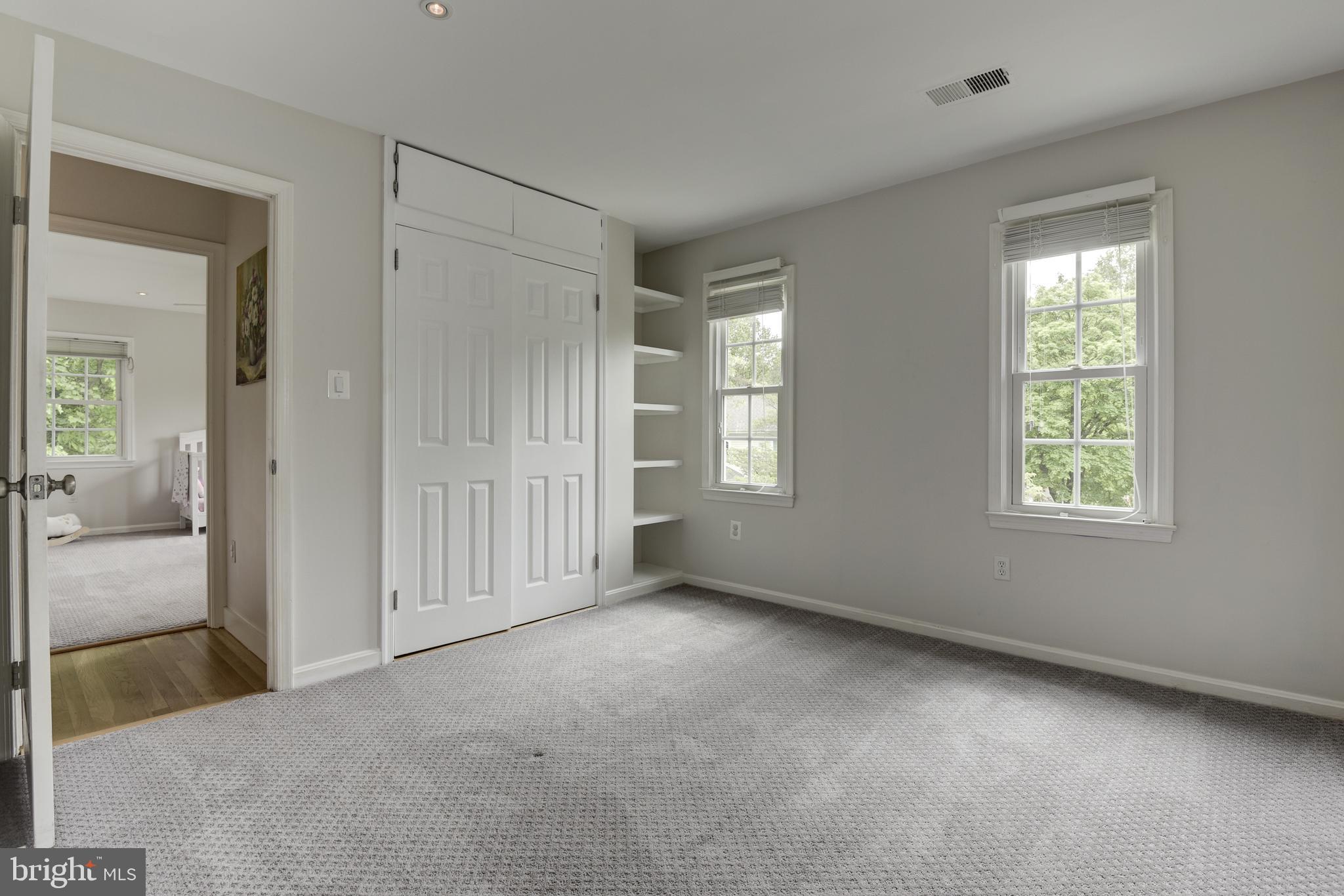 10394 Adel Road Oakton, VA 22124 - Photo 16 of 21 Bedroom 3 with shelving and custom closet