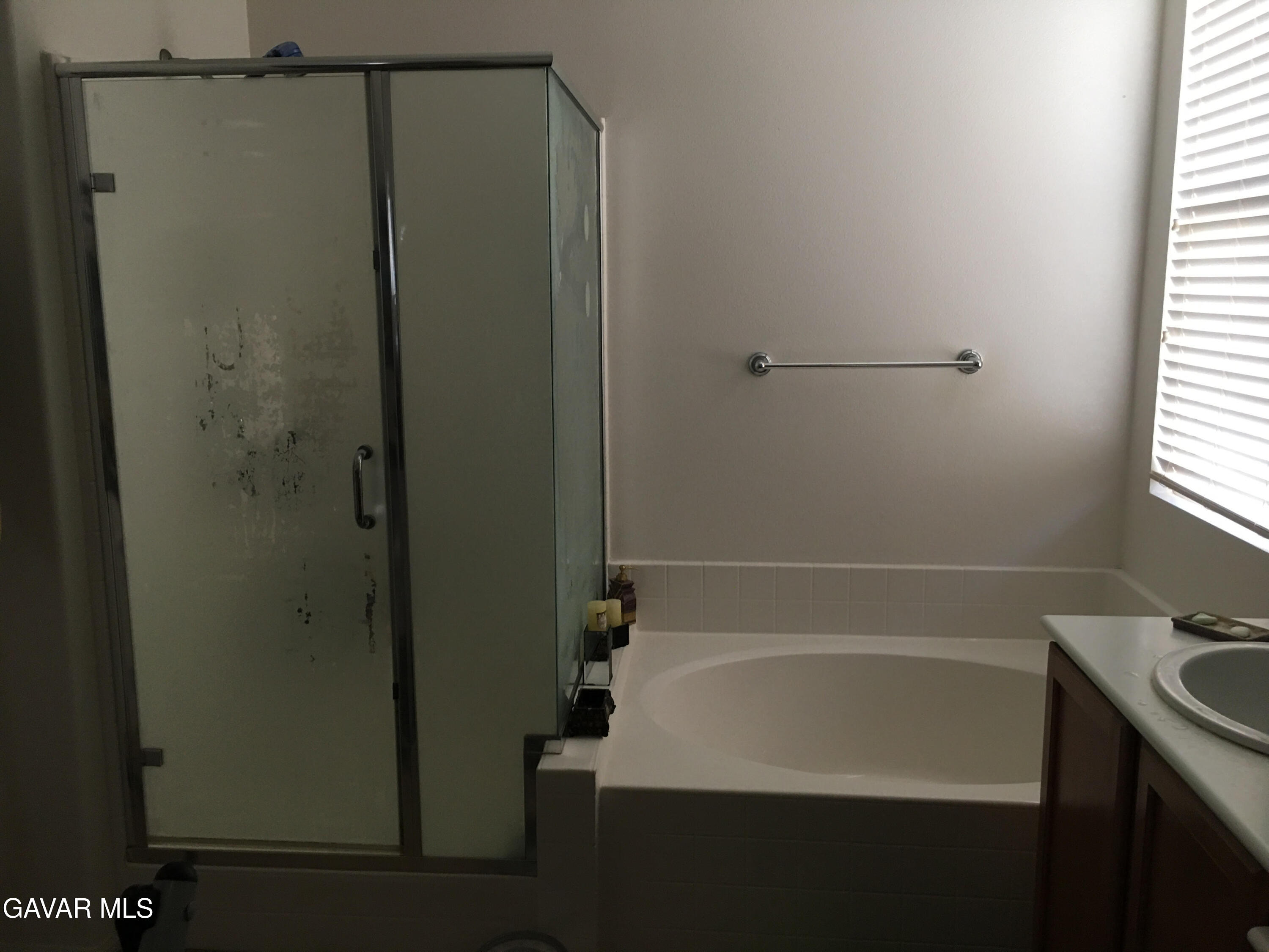 3303 Arious Way Lancaster, CA 93536 - Photo 16 of 43 a bathroom with a bathtub and a shower