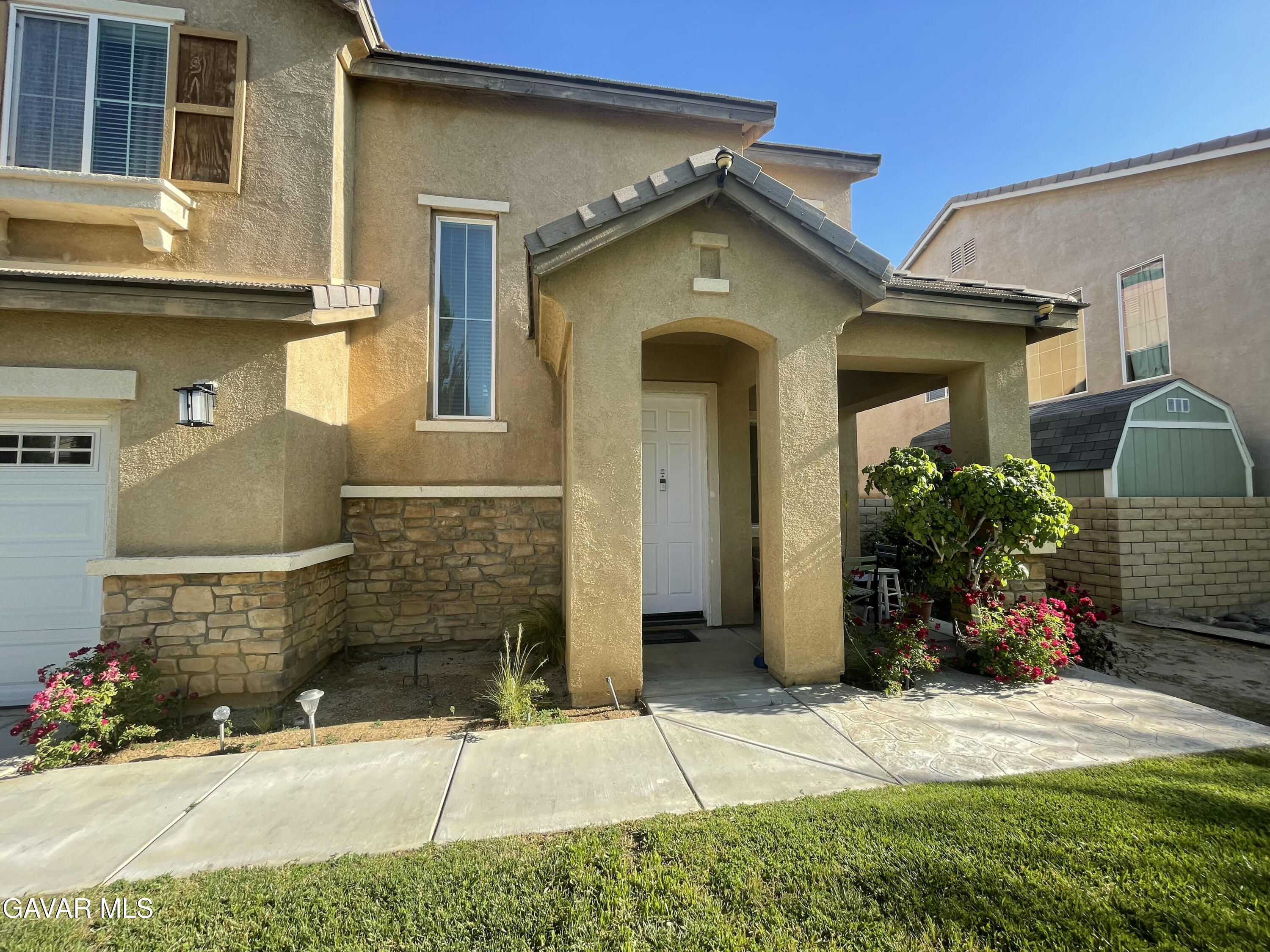 3303 Arious Way Lancaster, CA 93536 - Photo 2 of 43 a front view of a house with a yard