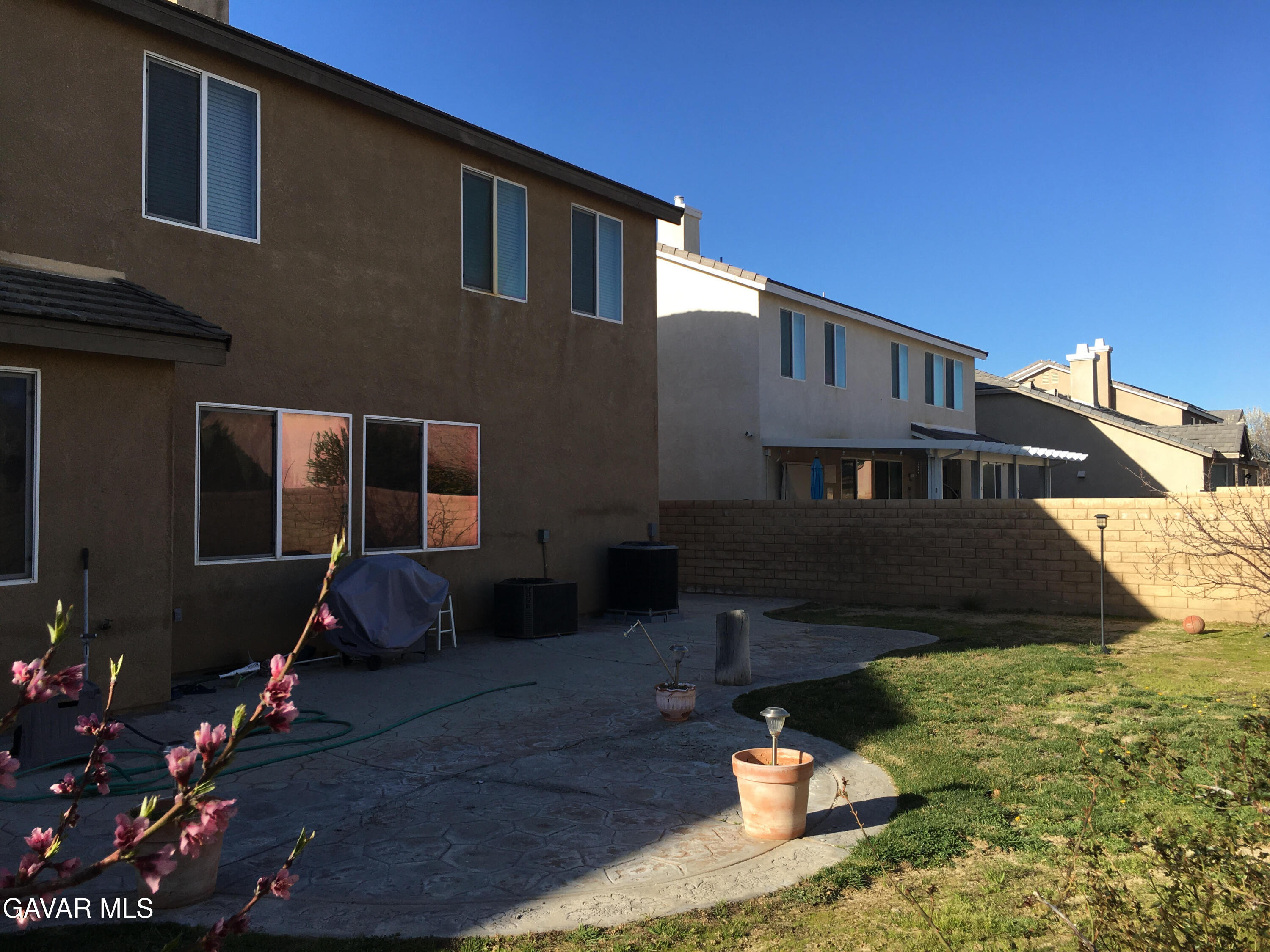 3303 Arious Way Lancaster, CA 93536 - Photo 23 of 43 a front view of a house with a yard