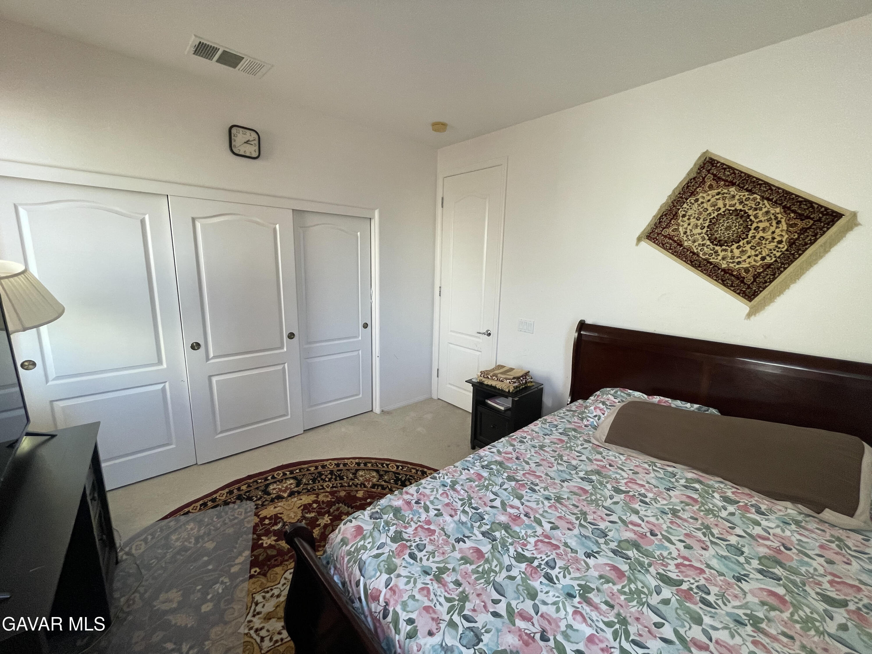 3303 Arious Way Lancaster, CA 93536 - Photo 33 of 43 a bedroom with a bed and furniture