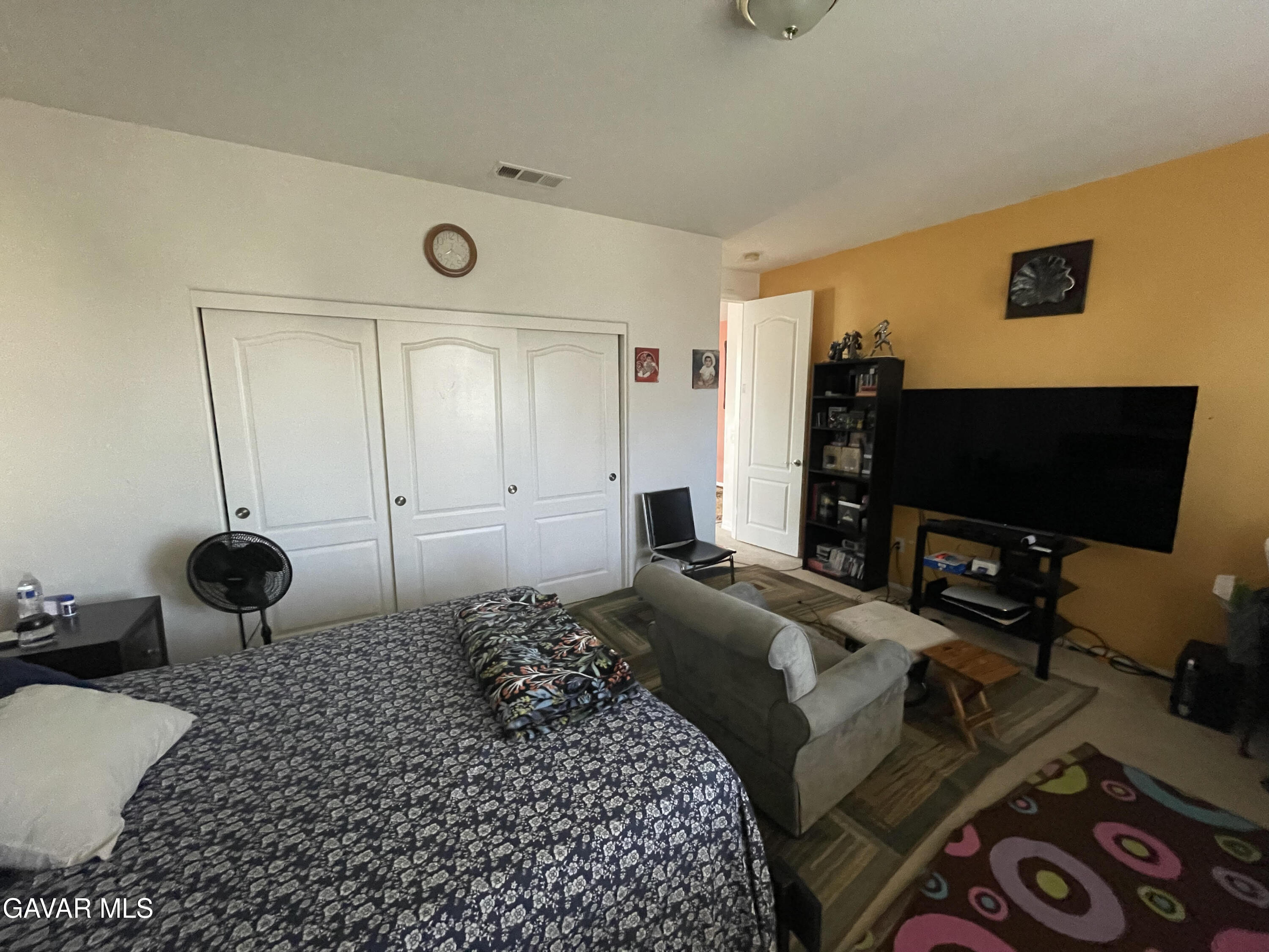 3303 Arious Way Lancaster, CA 93536 - Photo 36 of 43 a bedroom with a bed and a flat screen tv