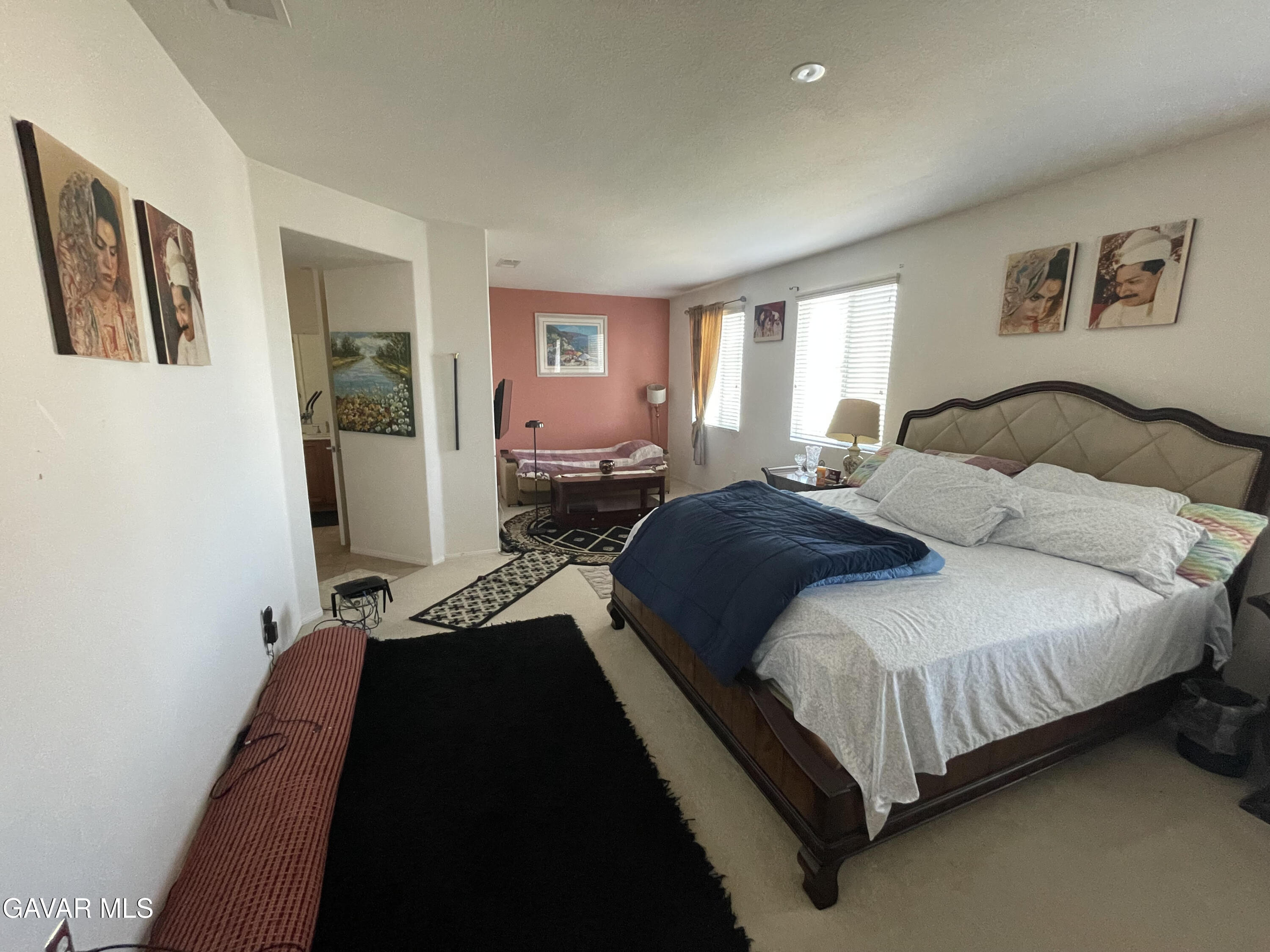 3303 Arious Way Lancaster, CA 93536 - Photo 37 of 43 a bedroom with a bed and a couch