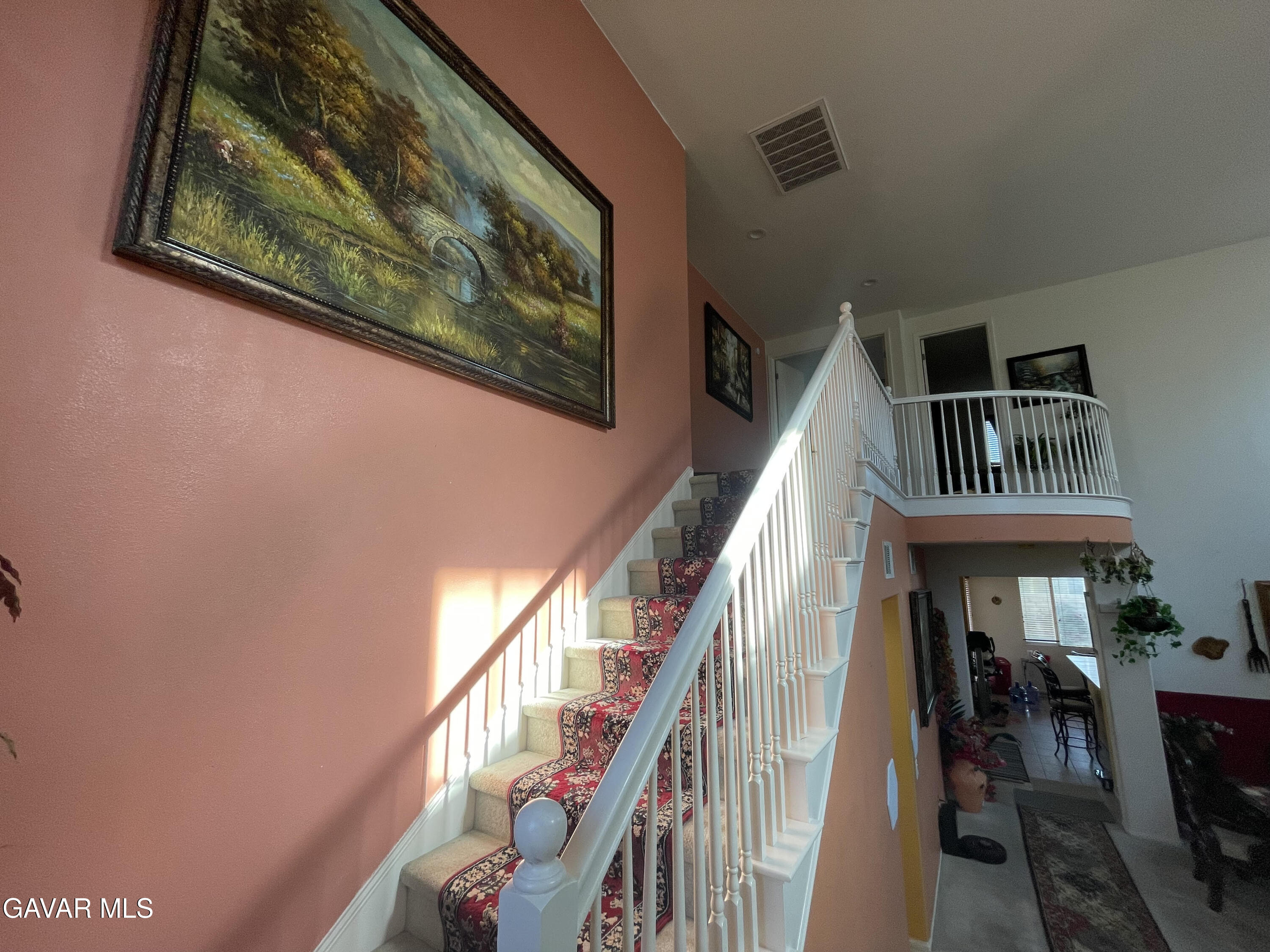 3303 Arious Way Lancaster, CA 93536 - Photo 9 of 43 a view of staircase with wooden floor and a rug