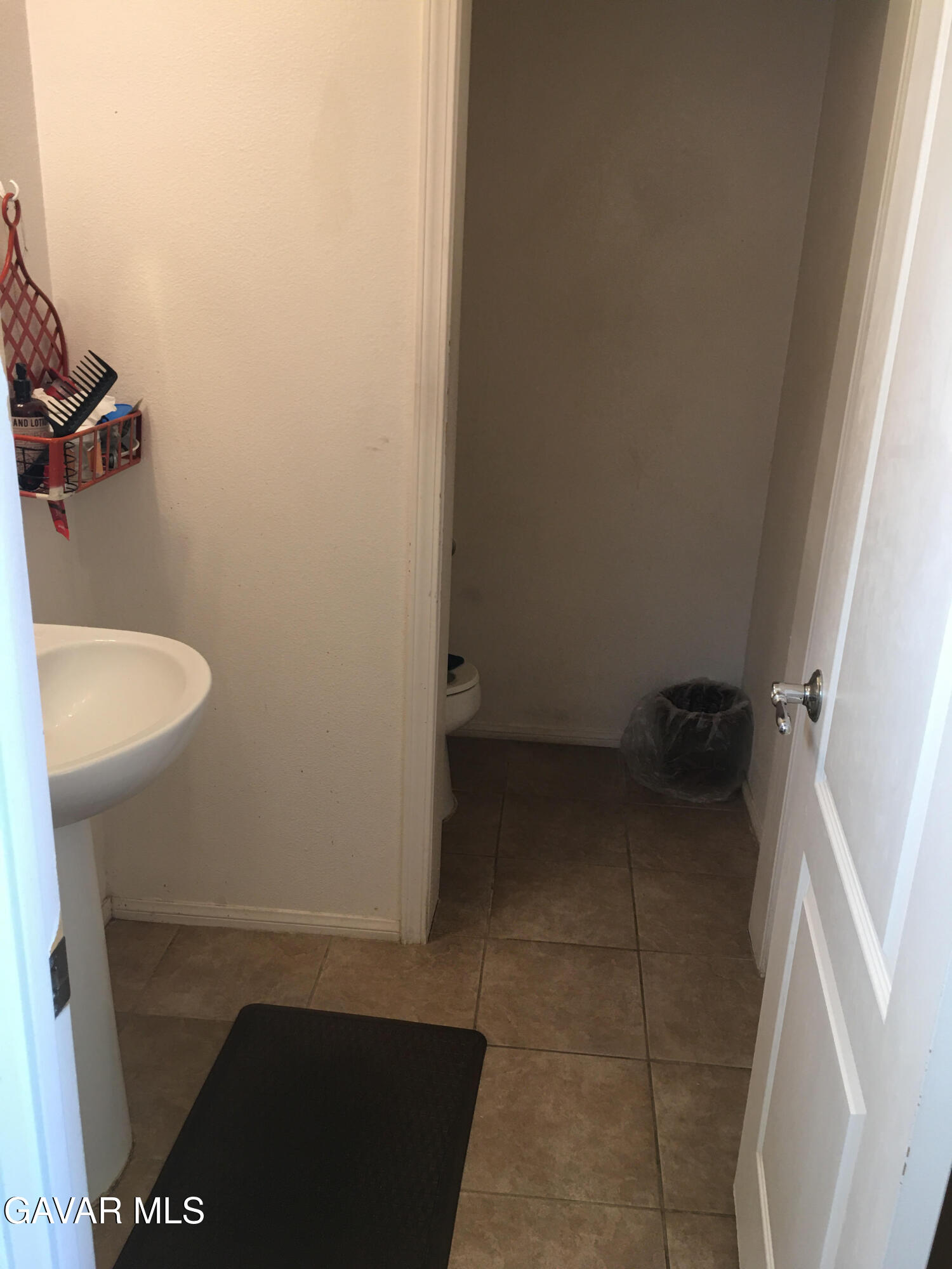 3303 Arious Way Lancaster, CA 93536 - Photo 10 of 43 a bathroom with a sink and toilet