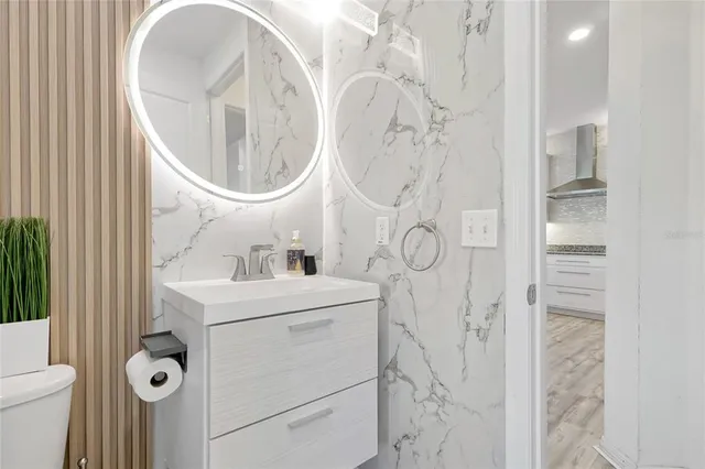 a bedroom with furniture and wooden floor