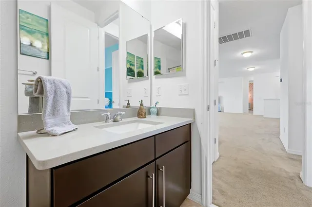 an empty room with closet and natural light