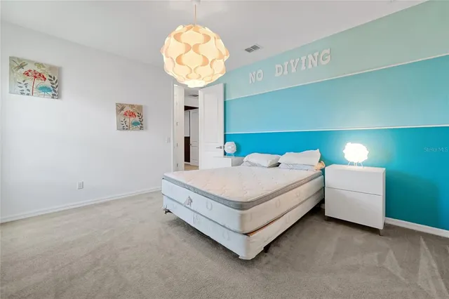 an aerial view of a house with a swimming pool yard and outdoor seating