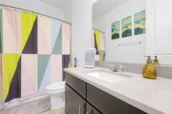 an aerial view of a house with a garden and lake view