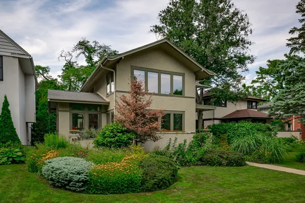 a front view of house with yard and green space