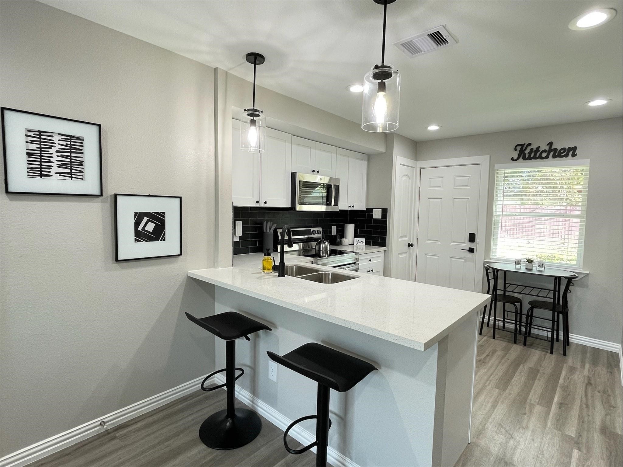 4322 Alconbury Lane, Unit 3 Houston, TX 77021 - Photo 4 of 30 a view of a dining room with furniture and wooden floor