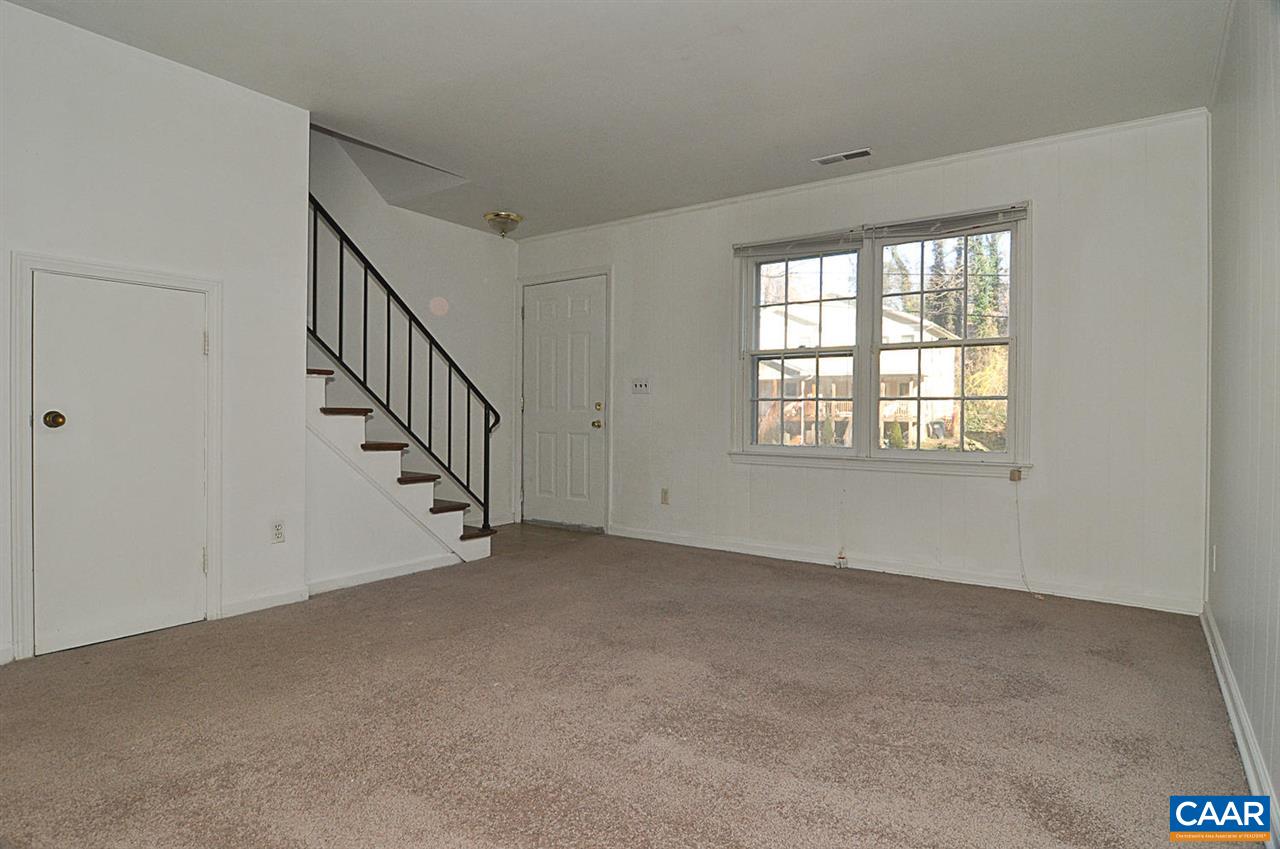319 Valley Rd Extension, Unit 319 Charlottesville, VA 22903 - Photo 3 of 15 a view of an empty room with stairs