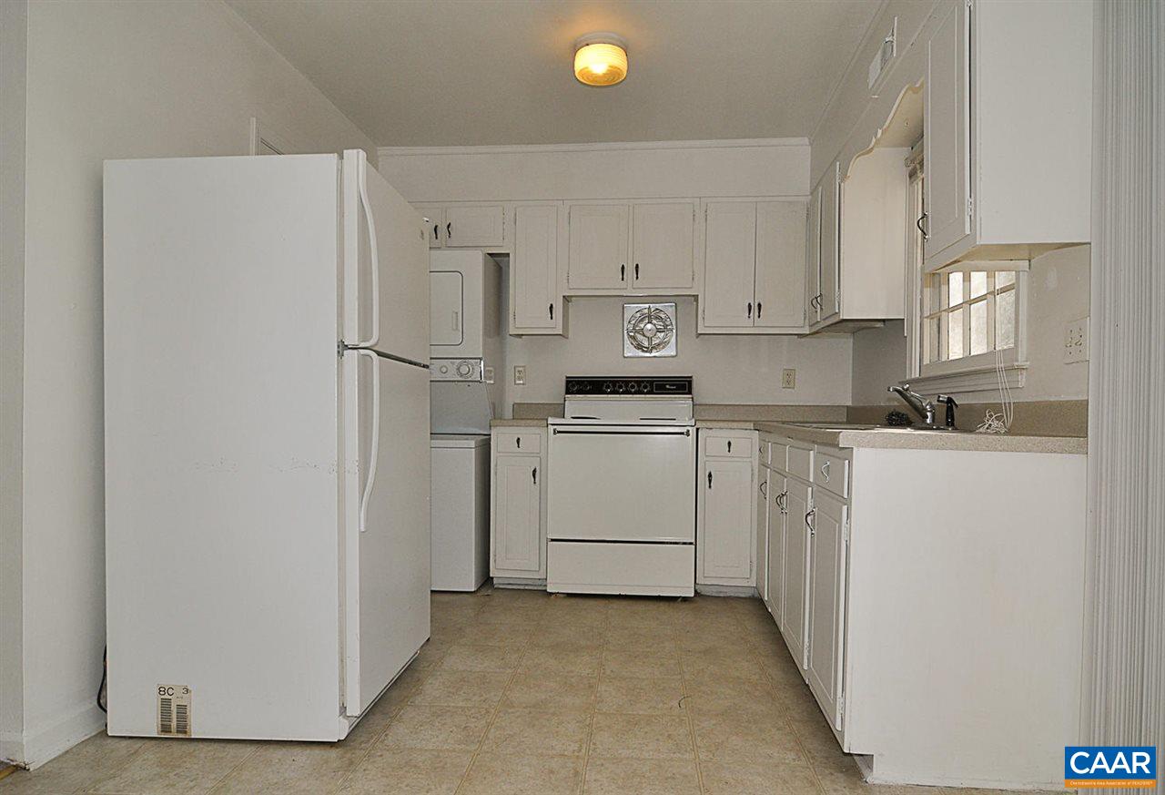319 Valley Rd Extension, Unit 319 Charlottesville, VA 22903 - Photo 7 of 15 a kitchen with white cabinets and white appliances