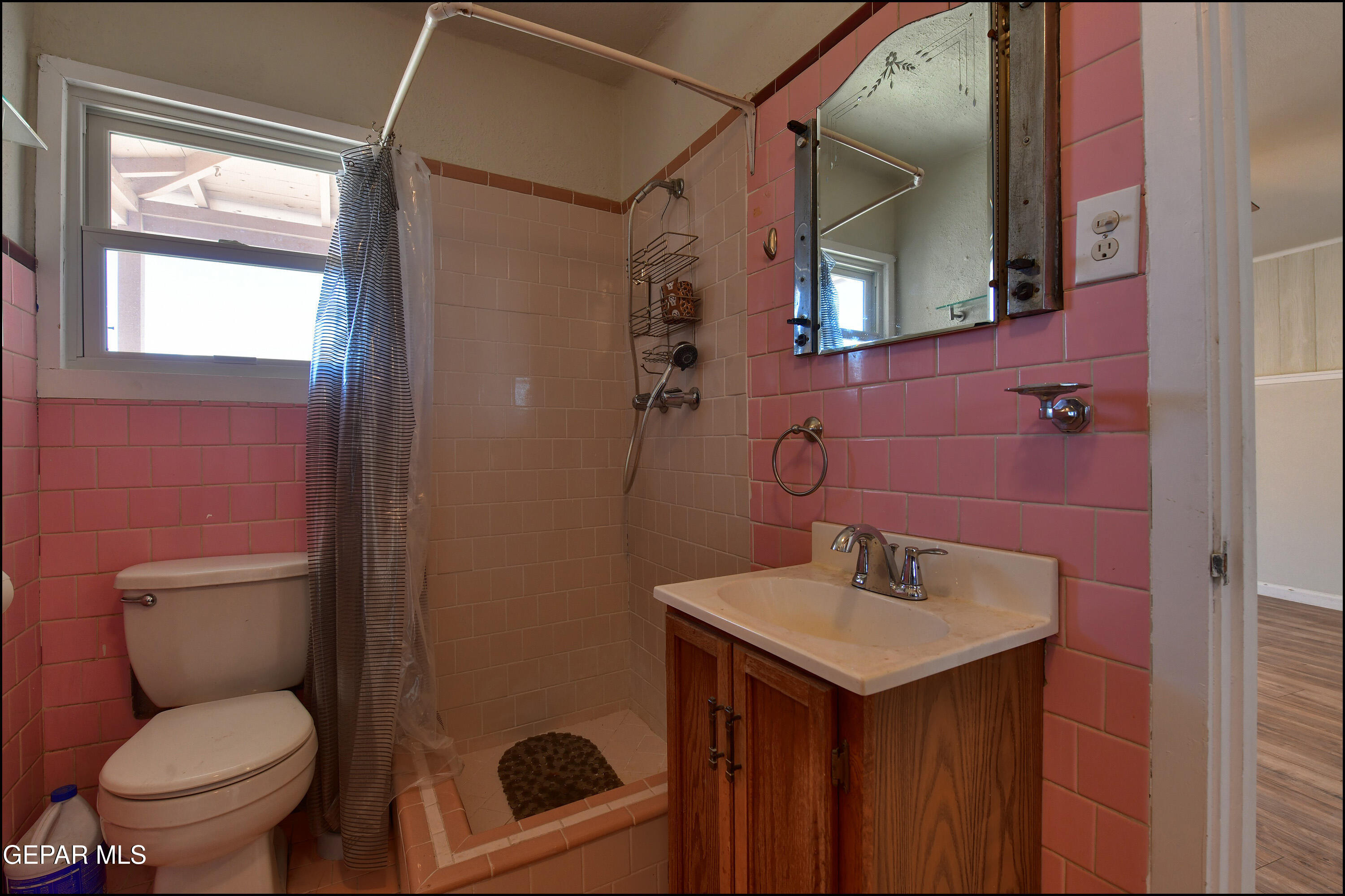 5107 Raymond Jays Road El Paso, TX 79903 - Photo 20 of 35 a bathroom with a toilet sink shower and mirror
