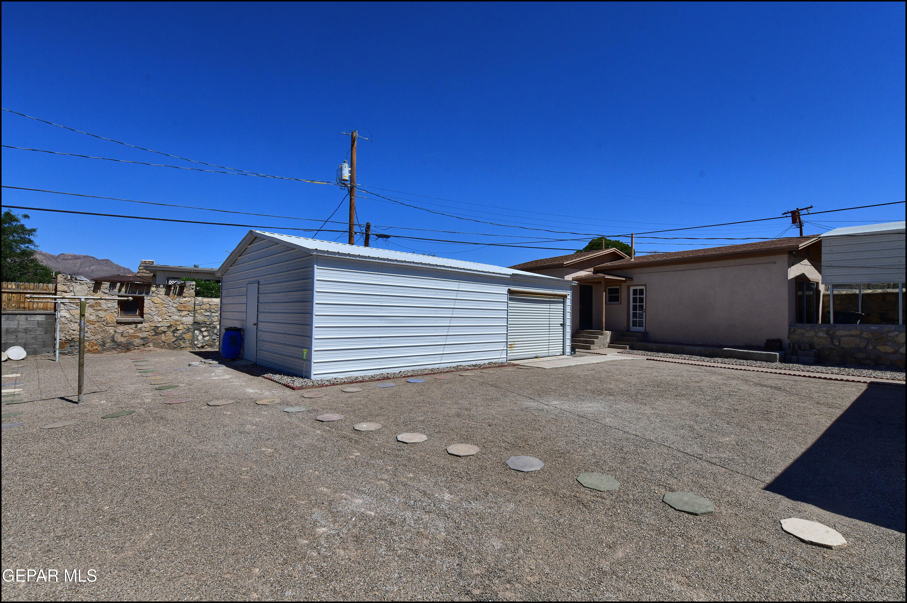 5107 Raymond Jays Road El Paso, TX 79903 - Photo 25 of 35 a view of a house with a garage