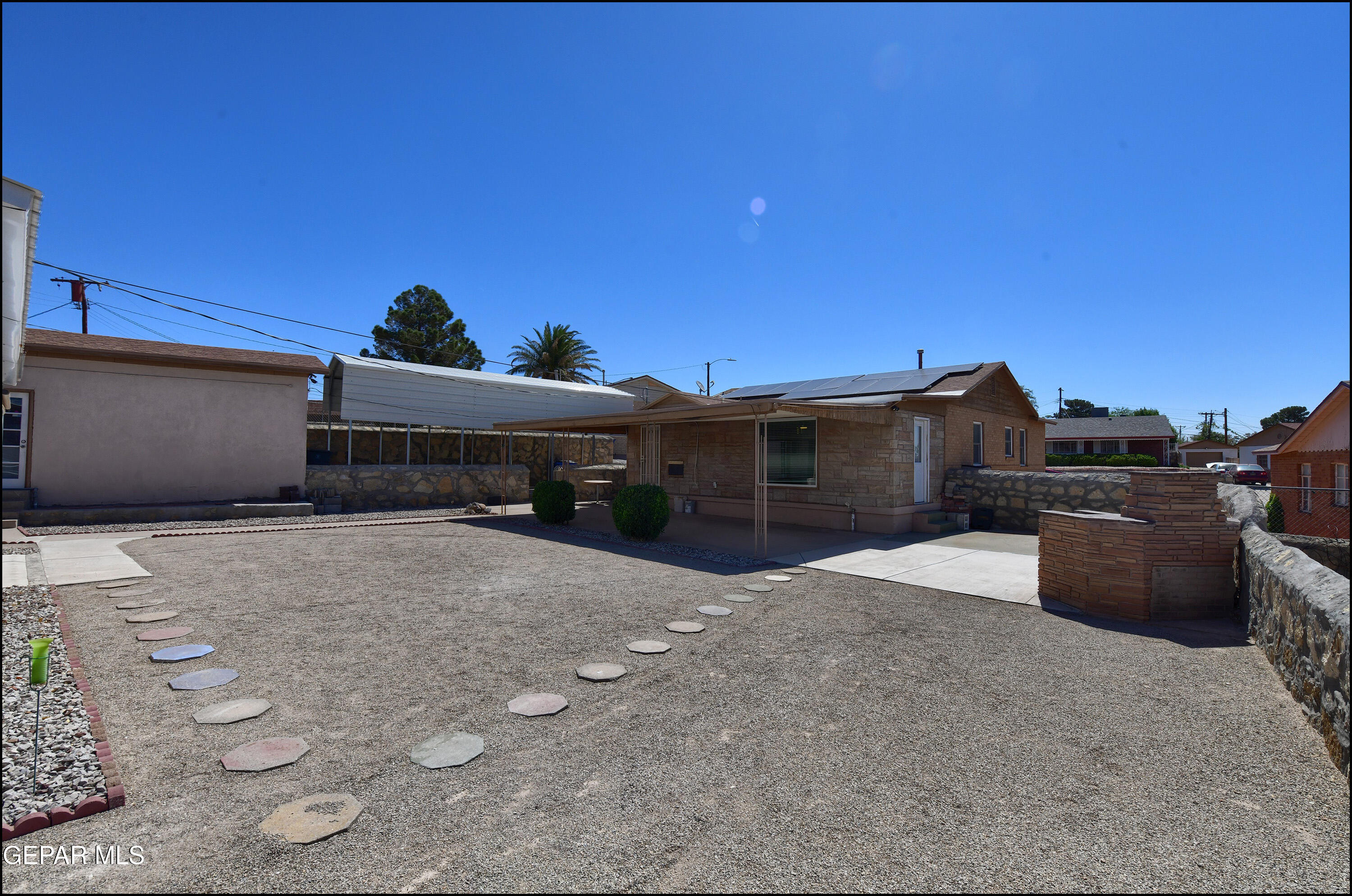 5107 Raymond Jays Road El Paso, TX 79903 - Photo 28 of 35 a front view of a house with a yard