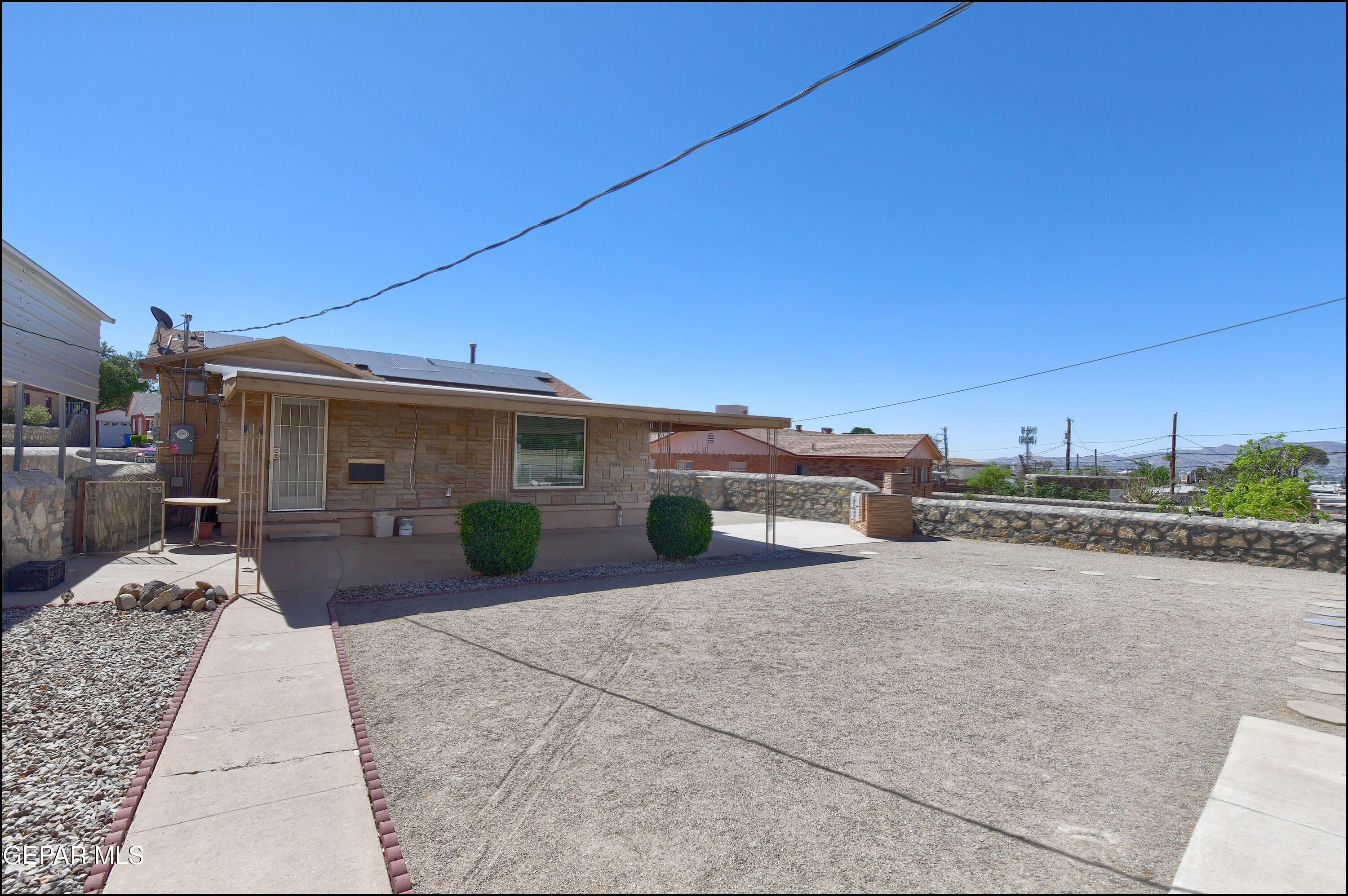 5107 Raymond Jays Road El Paso, TX 79903 - Photo 29 of 35 a view of a house with backyard and porch