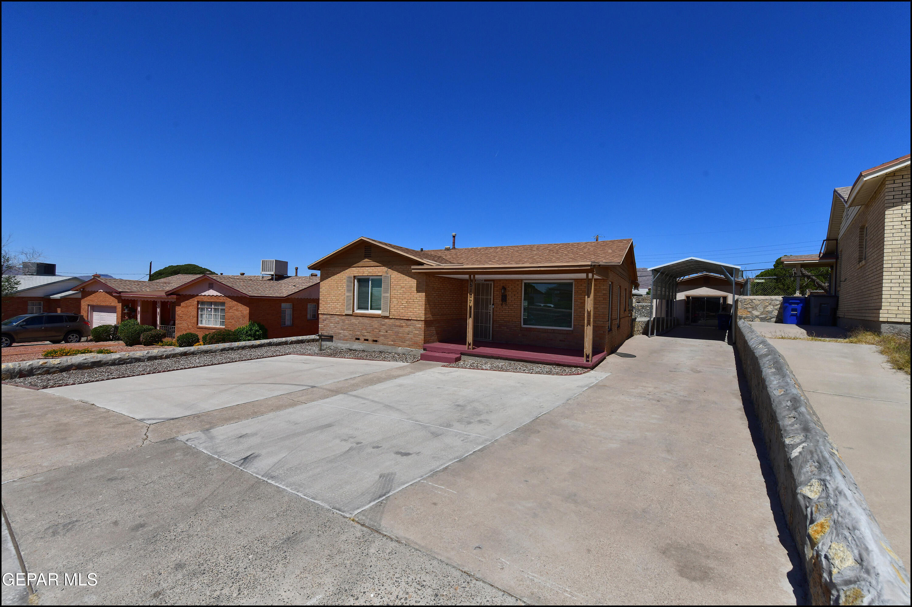 5107 Raymond Jays Road El Paso, TX 79903 - Photo 3 of 35 a car parked in front of a house with cars parked