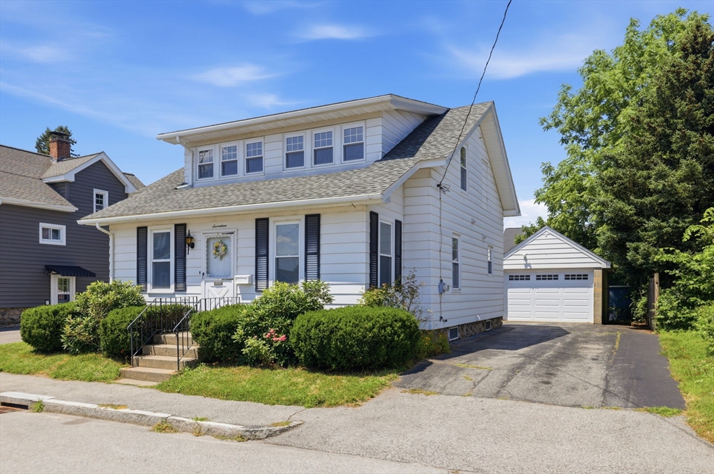 17 Rollinson Road Worcester, MA 01606 - Photo 1 of 41 a front view of a house with a yard and potted plants