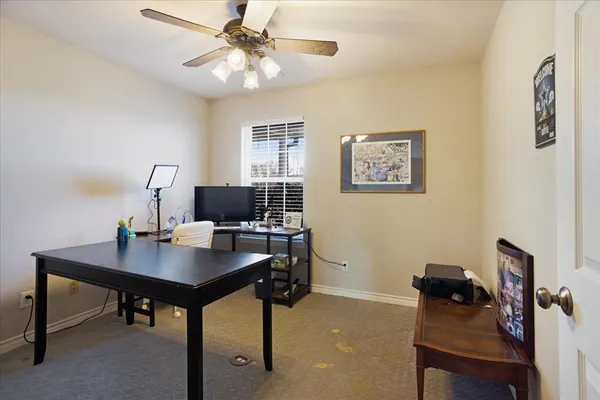 a workspace with furniture and window