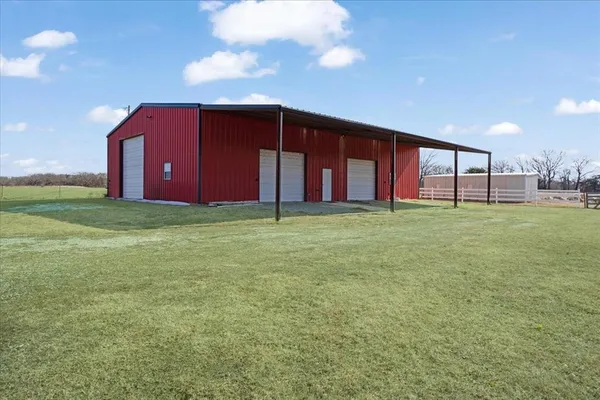 a view of a house with a big yard