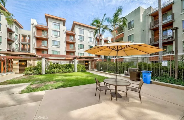 a view of a building with a backyard