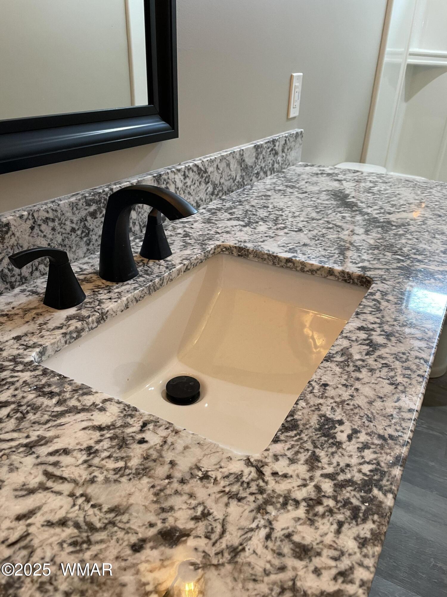 2426 Aspen Run Pinetop, AZ 85935 - Photo 17 of 44 a bathroom with a granite countertop sink and a mirror