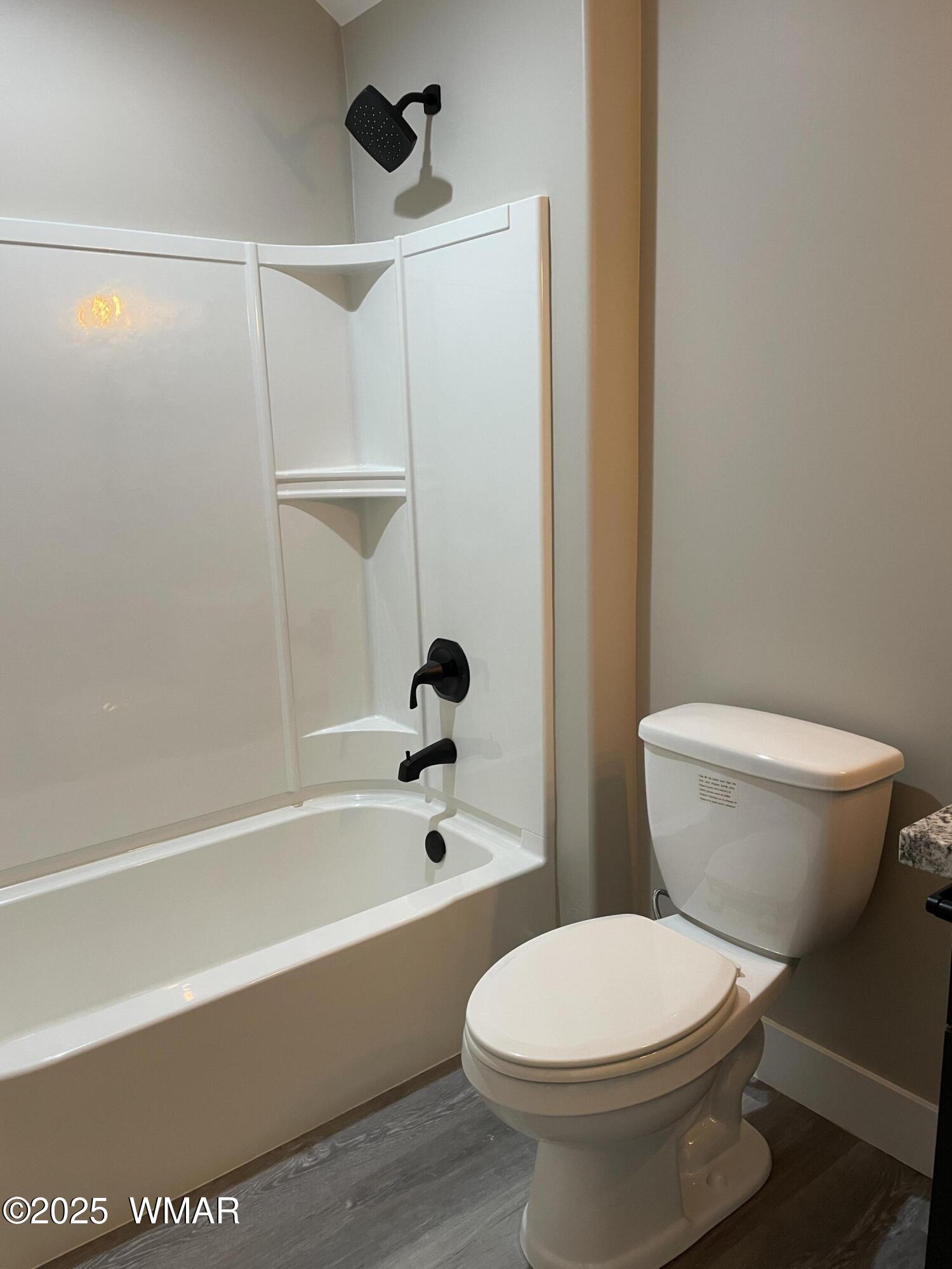 2426 Aspen Run Pinetop, AZ 85935 - Photo 28 of 44 a bathroom with a toilet and a bath tub