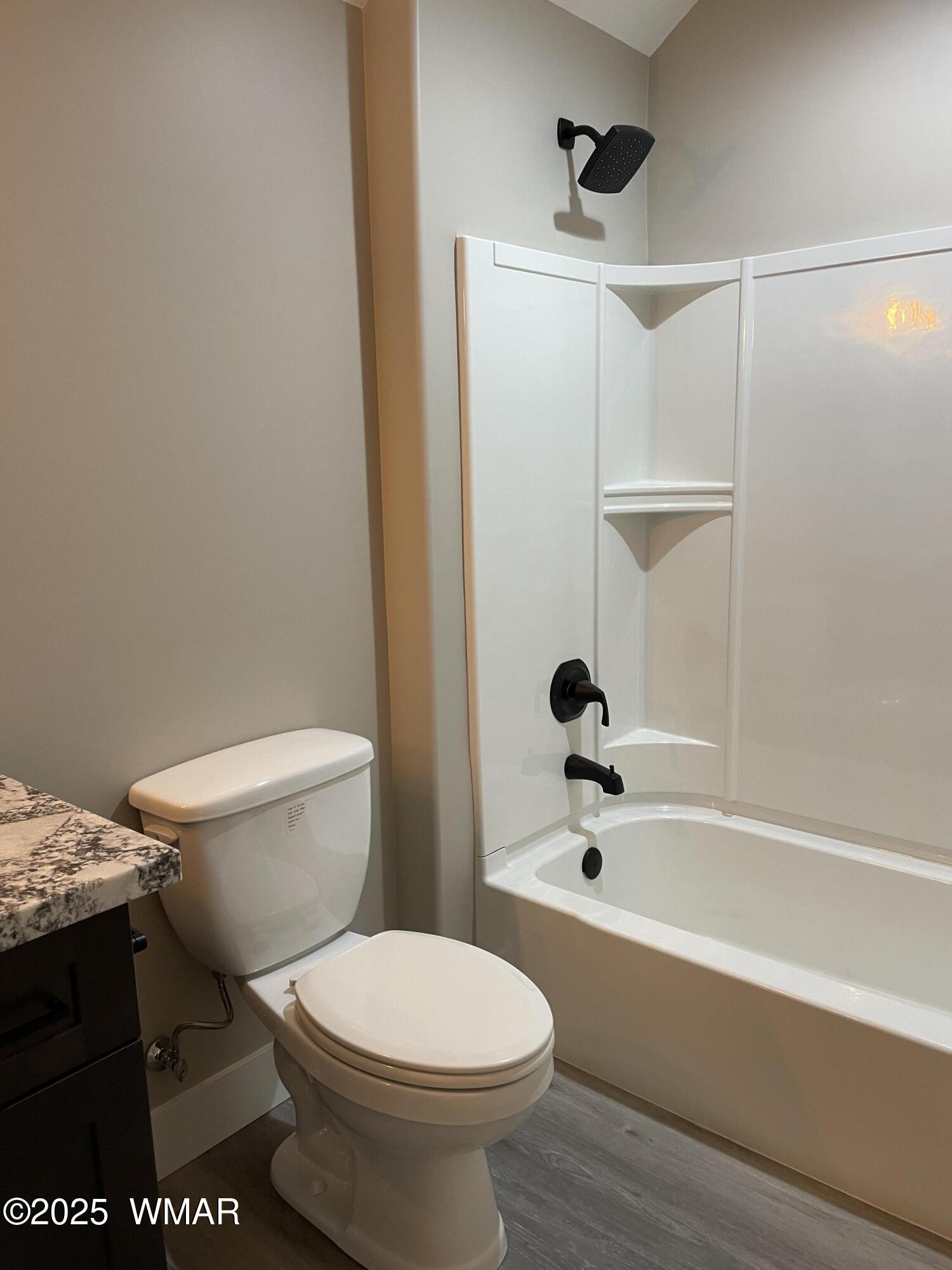 2426 Aspen Run Pinetop, AZ 85935 - Photo 31 of 44 a bathroom with a toilet and a shower