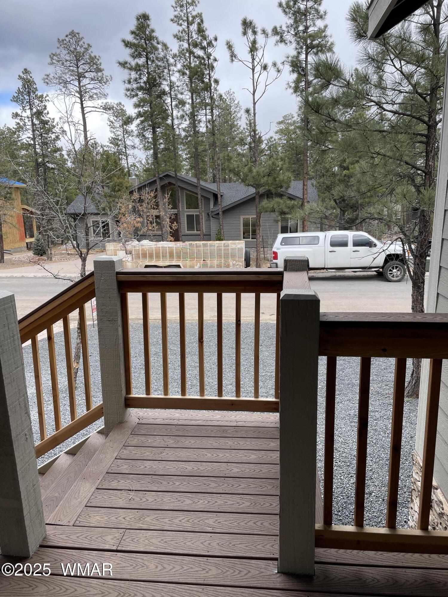 2426 Aspen Run Pinetop, AZ 85935 - Photo 37 of 44 a view of a balcony with wooden floor and fence
