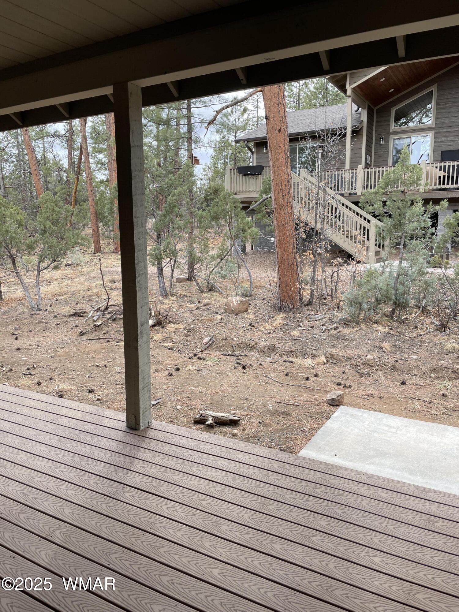 2426 Aspen Run Pinetop, AZ 85935 - Photo 43 of 44 a view of a wooden deck and a yard