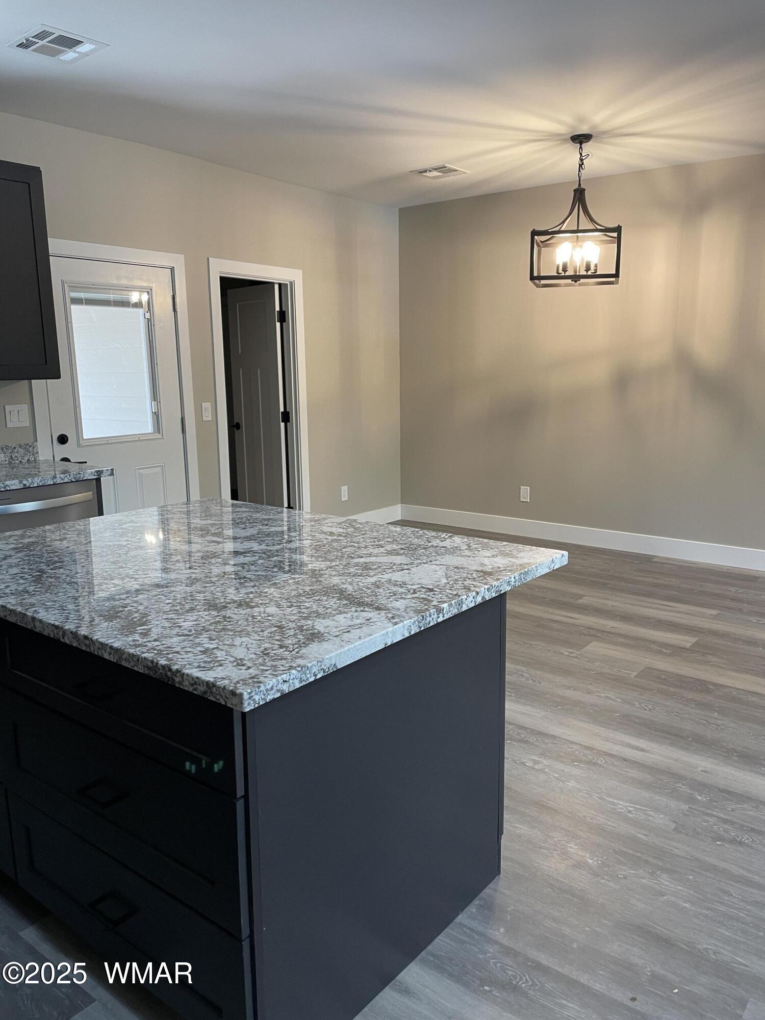 2426 Aspen Run Pinetop, AZ 85935 - Photo 10 of 44 a bathroom with a granite countertop sink and a mirror
